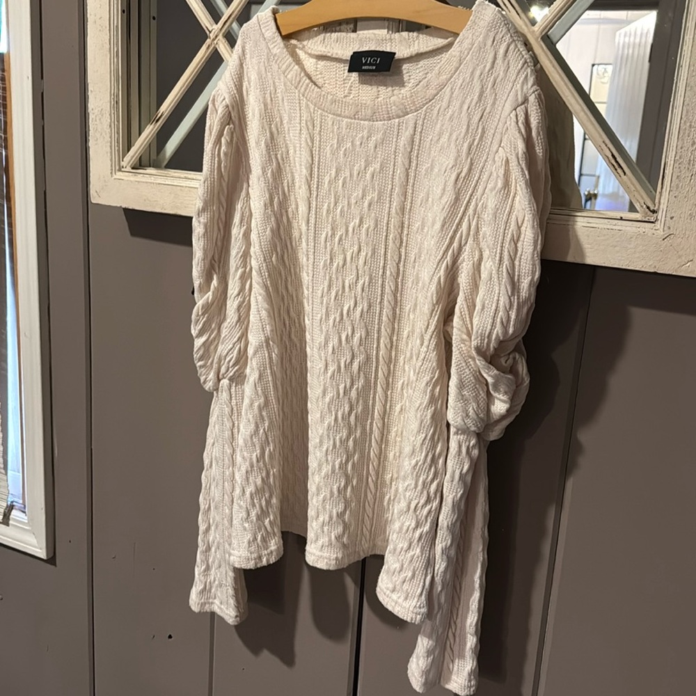 Women’s high sweater with peplum sleeves